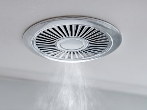 Ceiling Round Air Conditioner Grid. AC Machinery Industry. Heat Exchange Equipment. Modern Central Conditioning System Chilled Water. Mounted HVAC fan coil unit. Hot summer. Fresh clean apartment air