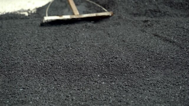 Paving Rake Smoothing Fresh Asphalt Road Surface
