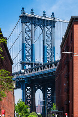 Naklejka premium Manhattan Bridge Framed by Historic Brick Buildings in DUMBO, Brooklyn