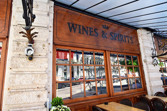 Geneva, Switzerland, Europe - 05.2026 : Grand Duke Pub, Art Nouveau style roofing, Wines and Spirits sign on wooden facade, outdoor tables, Rue de Monthoux, city center near Cornavin train station