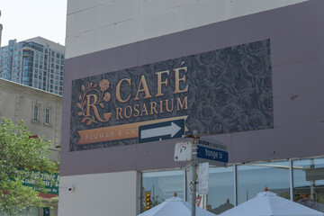 Fototapeta premium exterior building and sign of Café Rosarium, a luxury European-style flower shop with a specialty coffee and pastry bar, 878 Yonge St, Toronto