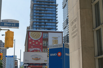 Fototapeta premium looking south on Church St from the northwest corner of Bloor St E (near Crown Life Insurance Company, BMO Bank of Montreal branch and billboards), Toronto