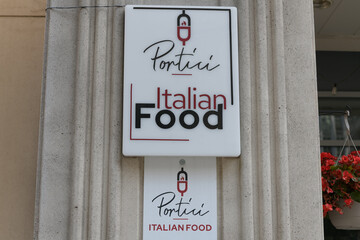 Fototapeta premium sign outside Portici, an Italian eatery, located at 6 Scollard St, Toronto