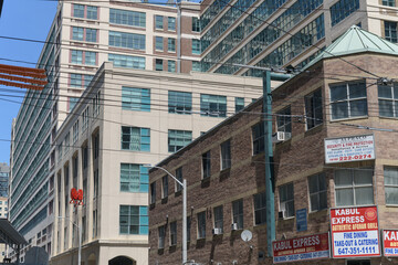 Fototapeta premium looking north on Dalhousie St from Dundas St E to new and historic architecture incl sign of Kabul Express, an Afghan restaurant (126 Dundas E), Toronto