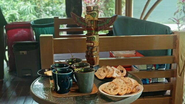 Hot herbal mint tea drink in mugs over wooden tray with fresh garden mint leaves,