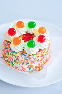 butter cake or coconut cake or sponge cake or a pound of  cake with jelly topping