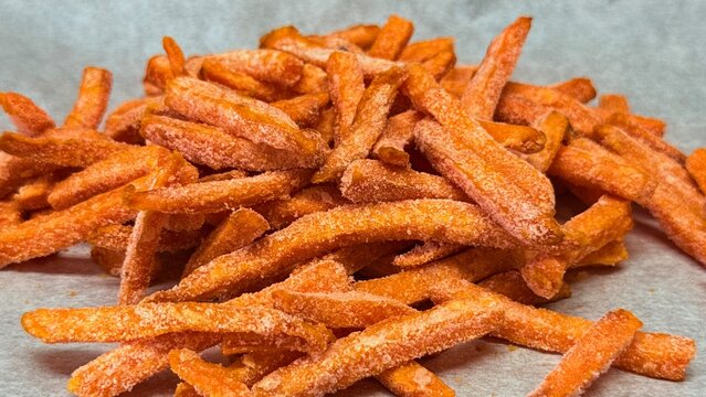 Frozen Sweet Potato Fries Close Up with Crispy Orange Texture. High quality photo