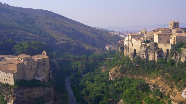 Medieval houses and cliffside old town skyline with Puente de San Pablo in Cuenca, Castilla La Mancha