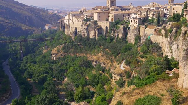 Puente de San Pablo and wooded Huecar gorge below the medieval cliffside town of Cuenca, Spain