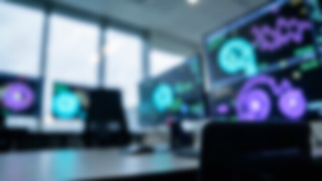 Blurred futuristic AI workplace setup with glowing screens for tech