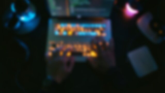 Overhead Dark Developer Workspace with Glowing Laptop for Tech
