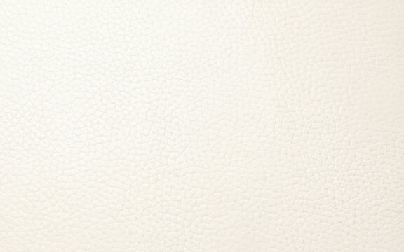 Cream colored leather texture with a grainy surface a full frame macro photograph grain creamy off white beige pale light material hide