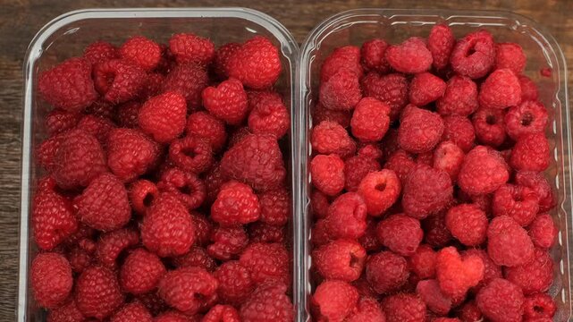Fresh raspberries in plastic boxes, slider view