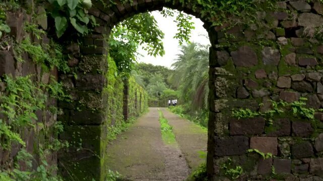 Vasai, Maharashtra, India - July 30, 2026: Historic Pathway Across Fort Walls During Monsoon.