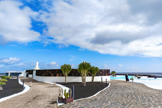 Arrecife, Lanzarote, Spain - December 17, 2025: Saltwater swimming pool at Islote de Fermina, a waterfront leisure complex designed by Cesar Manrique and restored as a public space