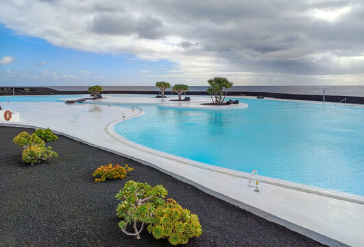 Arrecife, Lanzarote, Spain - December 17, 2025: Architectural view of the saltwater pool at Islote de Fermina, a restored coastal leisure complex and popular attraction in Arrecife