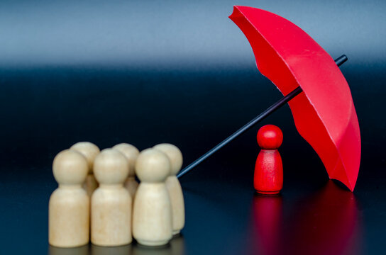 Single leader protected by umbrella representing insurance security, confidence, and trusted decision-making.