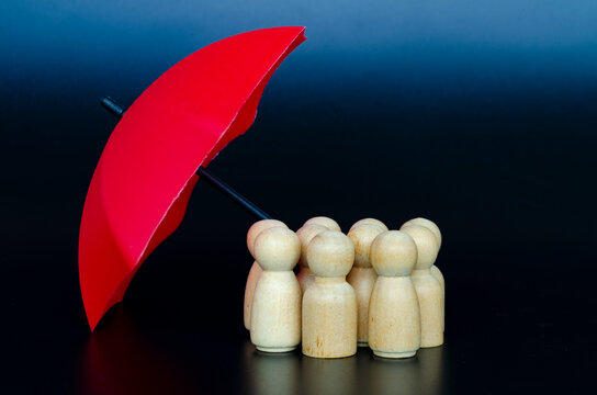 Group of followers receiving umbrella protection representing effective leadership and risk management.