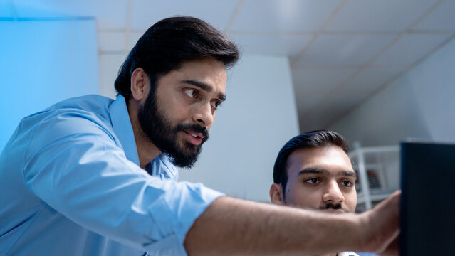 Team engineers software developers are brainstorming and using computer writing code to develop AI technology. Programmer using laptop work system about artificial intelligence and cyber security 