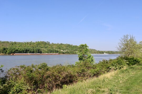The flowing river  in the countryside on a sunny day.