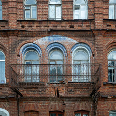 Obraz premium Kimry, Tver Oblast, Russia, July 25 2026 — Ornate Brick Facade with Arched Windows and Iron Balcony