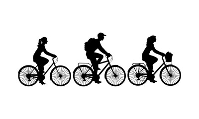 Fototapeta premium Three people riding different bicycles silhouette