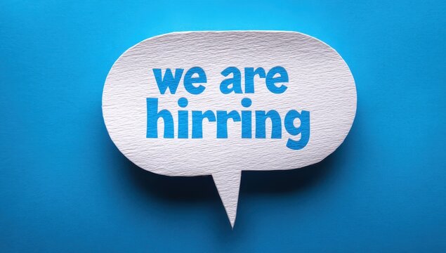 We are hirring typo on textured paper speech bubble on blue surface with employment recruitment business corporate announcement opportunity staffing resources personnel recruiting