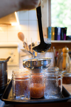 Pouring jam into jars