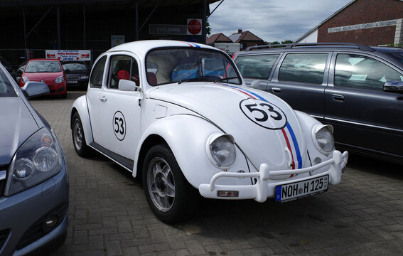 Hoogstede, Germany - July 2 2026 White VW Beetle with rally stripes, the number 53, and headlight eyelids. Clearly a tribute to the movie "Herbie".