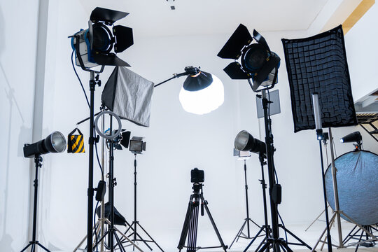 White studio set up with camera and lighting equipment