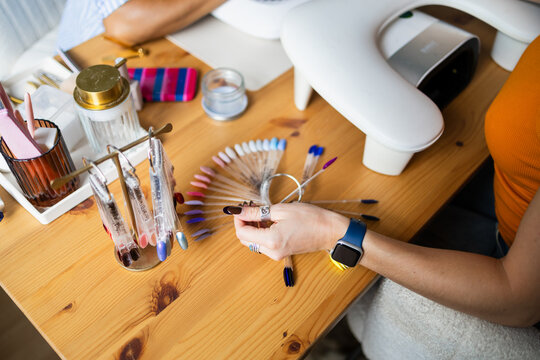 Choosing nail polish colors before a manicure