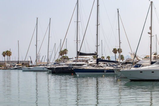 Luxury yachts and sailing boats peacefully moored at Sotogrande Marina on Spain's Mediterranean coast.