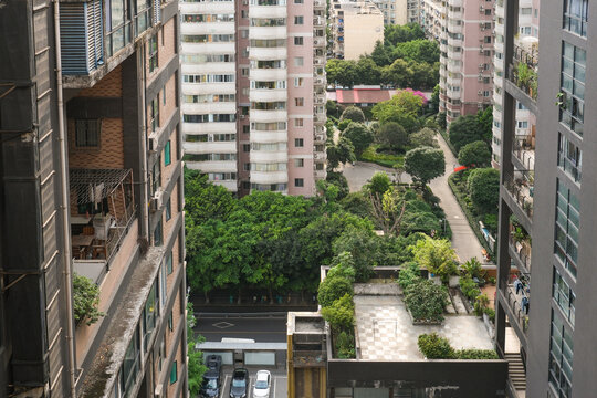 Green courtyard surrounded by residential towers