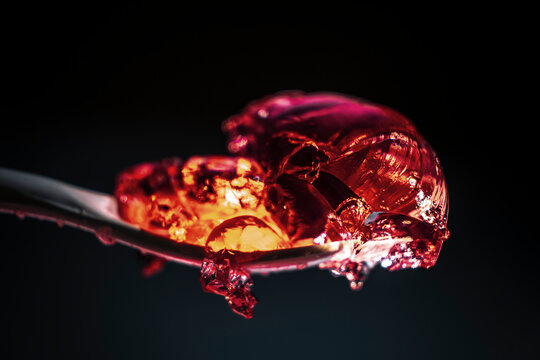 Exploring the Texture and Color of Jelly on a Spoon