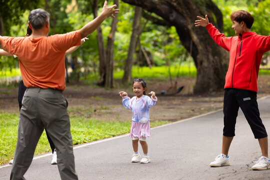 family stretching in city park summer. healthy lifestyle in nature. Father mother, kids daughter exercise together. Family team, healthy children. healthy lifestyle and family bonding