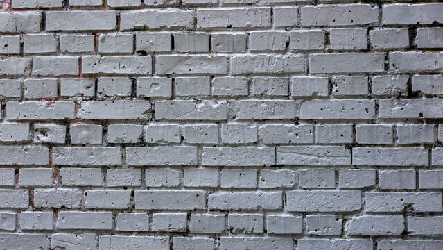  Light gray painted brick wall texture with weathered mortar lines