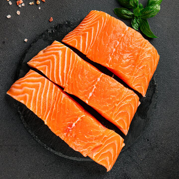 Raw salmon red fish fillet fresh seafood tasty snack &nbsp;pescetarian diet delicious gourmet food background on the table rustic food top view copy space keto and paleo diets vegetarian food
