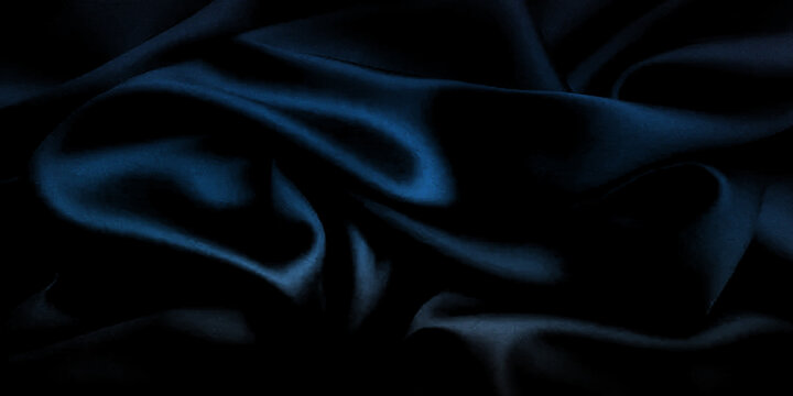 Luxury dark blue silk fabric background with soft waves and shadows for photography.
