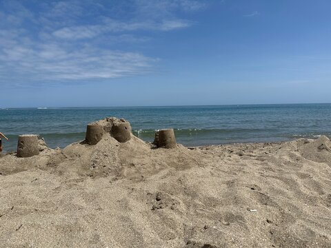 Sand castle building on a beach with sea view