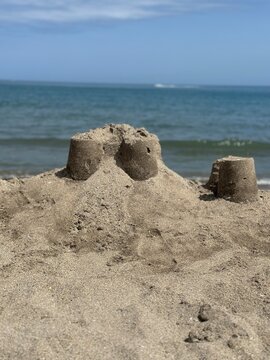 Sand castle building on a beach with sea view