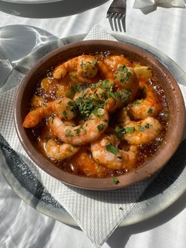 Famous Spanish tapa dish - prawns with garlic and paprika in olive oil