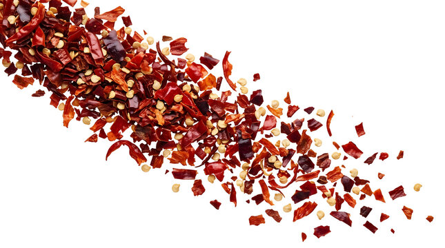 Red chili pepper flakes falling in the air