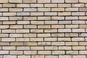 Fototapeta premium Beige brick wall as a background, texture, pattern.
