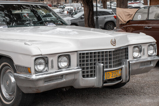 corfu, corfu, Greece. February 16, 2025: A white Cadillac DeVille parked on the street.