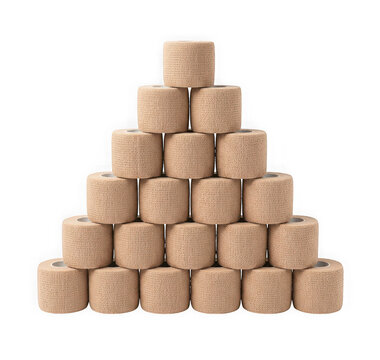 Pyramid stack of beige cohesive bandage rolls isolated on transparent background