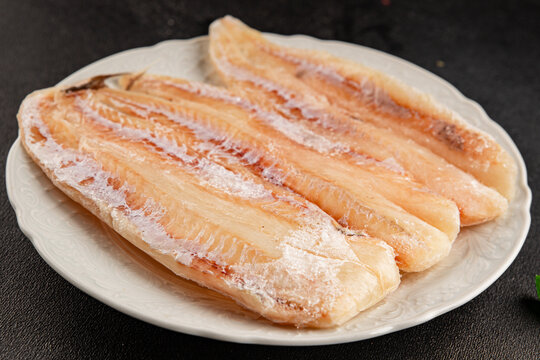 Frozen fish seafood&nbsp;white fish fillet pescetarian diet tasty snack fresh and delicious gourmet food background on the table rustic food top view copy space keto and paleo diet