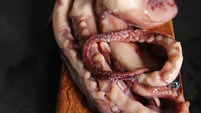 Octopus food octopus tentacles dish&nbsp;seafood cooked in boiling water tasty snack fresh and delicious rustic gourmet food background on the table&nbsp; rustic food top view copy space pescetarian diet