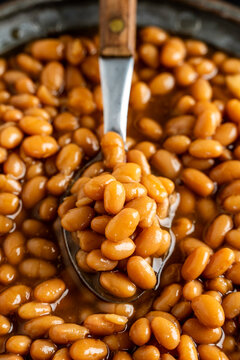 Closeup of baked beans with a spoon 