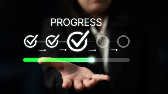 Businessperson Showing Progress Indicators on a Digital Interface with Check Marks and Progress Bar on a Dark Background. Bitwise.