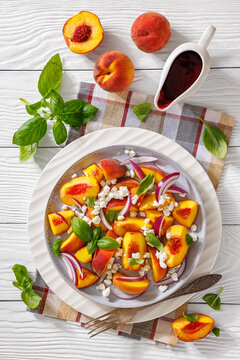 Italian peach salad with cheese, basil leaves